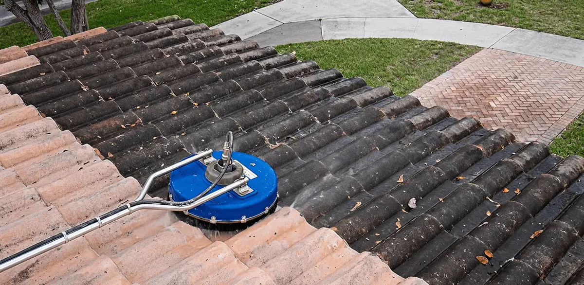 Roof pressure cleaning removing debris and buildup from roof tiles in Anchorage, AK